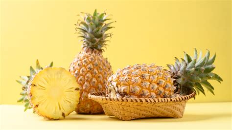 What kind of fruit is a pineapple, and why does it wear a crown?